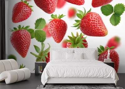 Flying juicy ripe strawberries with leaves isolated on a white background Wall mural