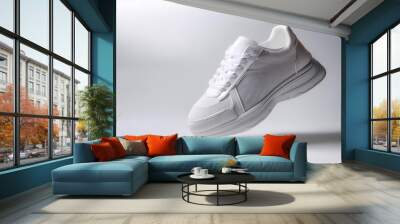 Plain white sneakers with minimalist design floating or flying isolated white background Wall mural