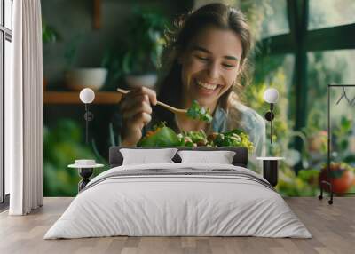 Woman eating salad with chopsticks Wall mural