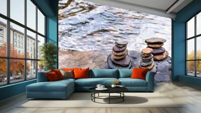 Balanced Zen rock stacks in a creek,View of a creek with stacked stones on a rock Wall mural