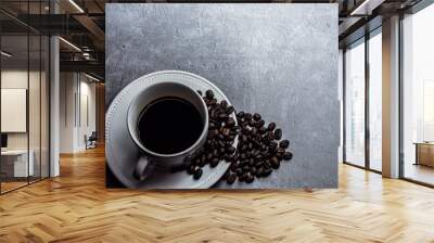 Coffee cup and coffee beans on table Wall mural