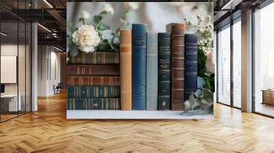 Arrange a few classic or vintage books with elegant covers Wall mural