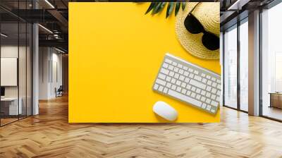 White computer keyboard, mouse and sunglasses on a yellow background Wall mural