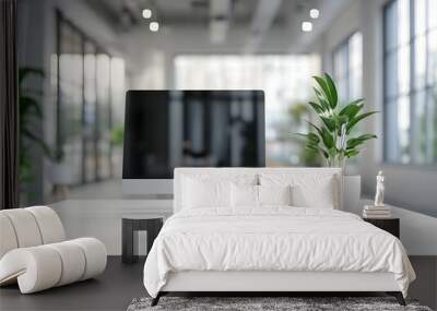 White desk with computer and office background blurred in the foreground,workspace Wall mural