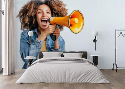 a vibrant woman in casual attire holding a megaphone Wall mural