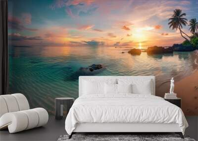 A tranquil beach at sunset with crystal-clear water and palm trees. Wall mural