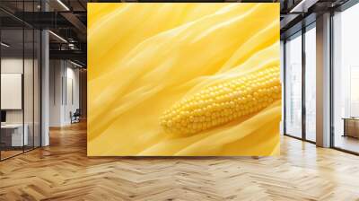 A vibrant yellow background with a close-up of fresh corn on the cob, showcasing its golden color and soft texture.  Wall mural