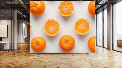 Tangerine and tangerines cut in half and whole on a white background, laid flat, top view Wall mural