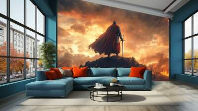 Victorious warrior standing atop a hill, sword raised high, with a battlefield in the background Wall mural