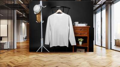 A shirt hanged on to a chair with minimalist decorations Wall mural