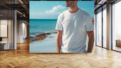 man on the beach in a white tshirt Wall mural