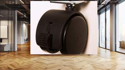 Close-up of the roller of the chair in the meeting room. Furniture plastic wheels. Wall mural