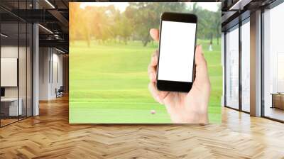 Touch screen in hand, tablet on golf club - soft blur background Wall mural