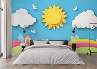 Bright paper craft landscape with sun, clouds, and colorful hills featuring small houses Wall mural