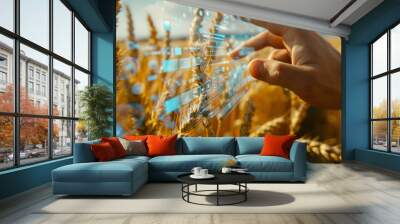 Hand on glass screen in wheat field Wall mural