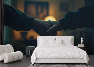 Two Hands Holding In A Darkened Room Wall mural