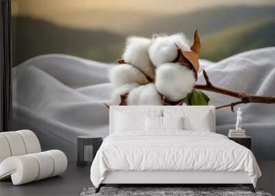 Cotton flower on white cotton fabric cloth background, cotton buds on a tree Wall mural