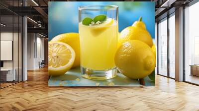 glass of lemonade, Close-up of lemon juice in a glass on a blue background Wall mural