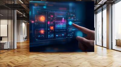 A hand interacting with a futuristic digital interface featuring data visualization and technology elements. Wall mural