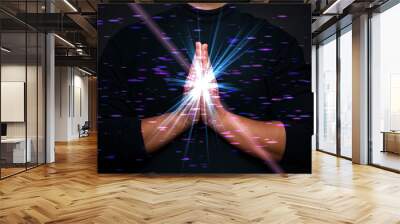 meditation hand with holy spiritual light, power of meditation, praying hand with bokeh light flare effect.  Wall mural