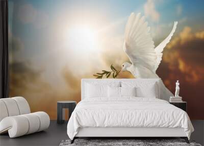 White Dove carrying olive leaf branch on Beautiful light and lens flare .Freedom concept and international day of peace , Free Clipping path  Wall mural