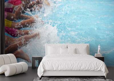 leg shot children learning swimming in swimming pool Wall mural