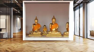 row of tradition golden buddha statue as background. Wall mural