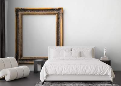 Antique brass frame with a detailed border and patina finish, isolated on white Wall mural