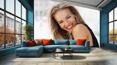 Happy young carefree woman smiling outdoor portrait Wall mural