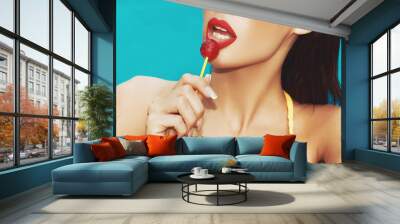 Sexy wet woman licking lollipop in swimminng pool widescreen banner Wall mural