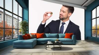 Young bearded stylish businessman holding bitcoin isolated Wall mural