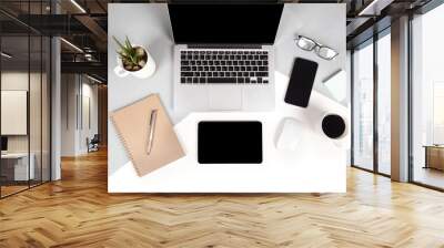 Flat lay photo of Office table with laptop computer, notebook, digital tablet, mobile phone, Pencil, eyeglasses  on modern two tone (white and grey) background. Desktop office mockup concept. Wall mural