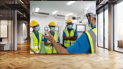 Factory workers meeting before work And put on a mask Wall mural