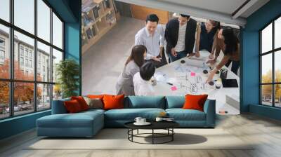 Group of Asian business people team meeting in modern office working design planning and ideas concept Wall mural