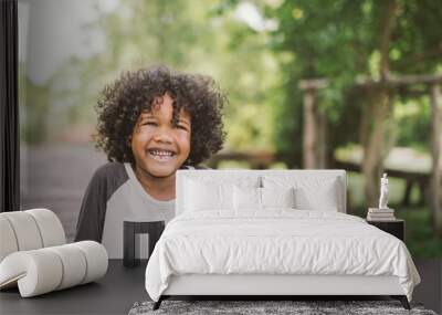 portrait of a cute african american little boy smiling. Wall mural