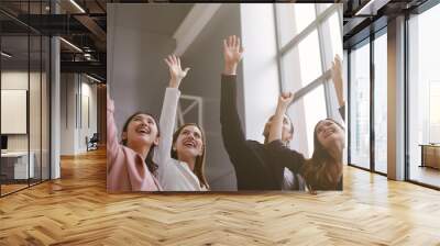 Successful of Business People Celebrating In office. Group of Happy business team hands raised for success and winning. Startup of young Asian businessman and businesswoman happy and smiling. Wall mural