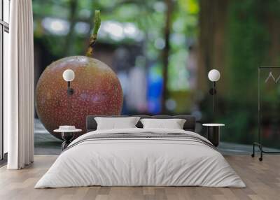 Passion fruit on a wooden table Wall mural