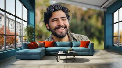 Handsome hispanic man with beard smiling happy outdoors Wall mural