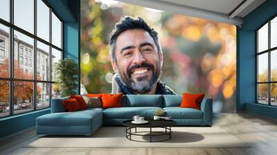 Handsome hispanic man with beard smiling happy outdoors Wall mural