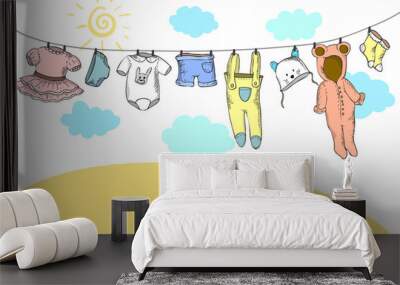 A vector illustration of baby clothing on clothespin Wall mural