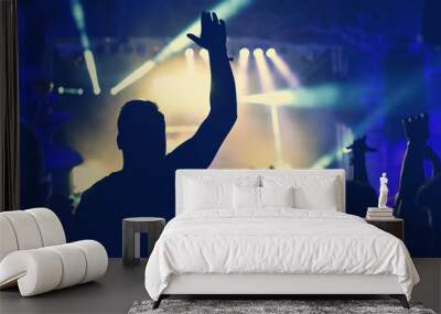 Crowd with arms outstretched at concert Wall mural