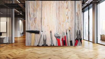 Working tools for repair on wooden background. The view from the top. Wall mural