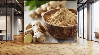 fresh ginger root and ground ginger powder in a wooden bowl Wall mural