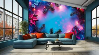 Bright Christmas flatlay with copy space in pink and blue colours made of poincettia flowers, spruce branches and Christmas lights.  Wall mural