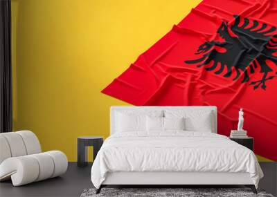 Flag of Albania. Fabric textured Albania flag isolated on yellow background. 3D illustration Wall mural