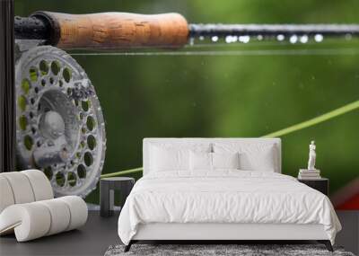 Fragment of a fly fishing rod with dew drops Wall mural