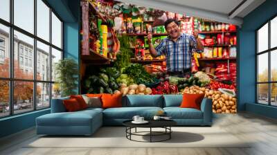 Grocery store in Guatemala with successful man celebrating, standing in a boxing position. Wall mural