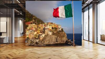 Manarola village in Cinque Terre with italian flag in foreground Wall mural