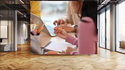 Cropped view businesspeople' hand working on notes and a laptop and having a meeting together, for business and technology concept. Wall mural