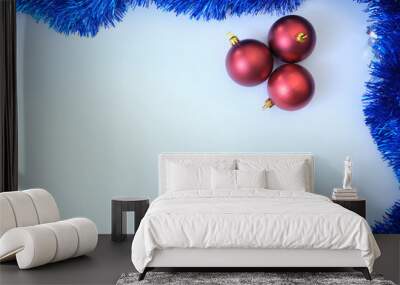 white background with isolated red christmas balls and blue sparkle Wall mural